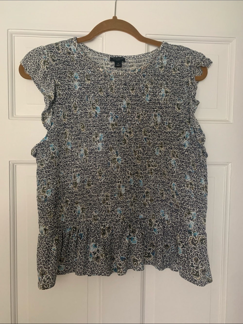 Ann Taylor smocked floral peplum top featuring flutter sleeves size PL